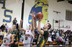 Conor Sullivan (15 points) goes for a block against Chris Capozzoli