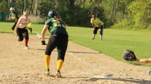 Emma Santosuosso tries to bunt as first baseman Kylie Currier charges