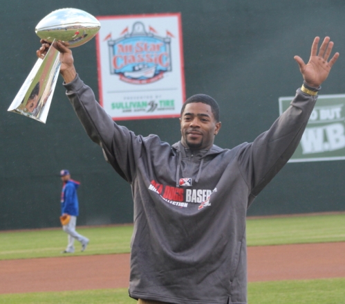 Super Bowl hero Malcolm Butler salutes the crowd at Hadlock Field with the SB trophy